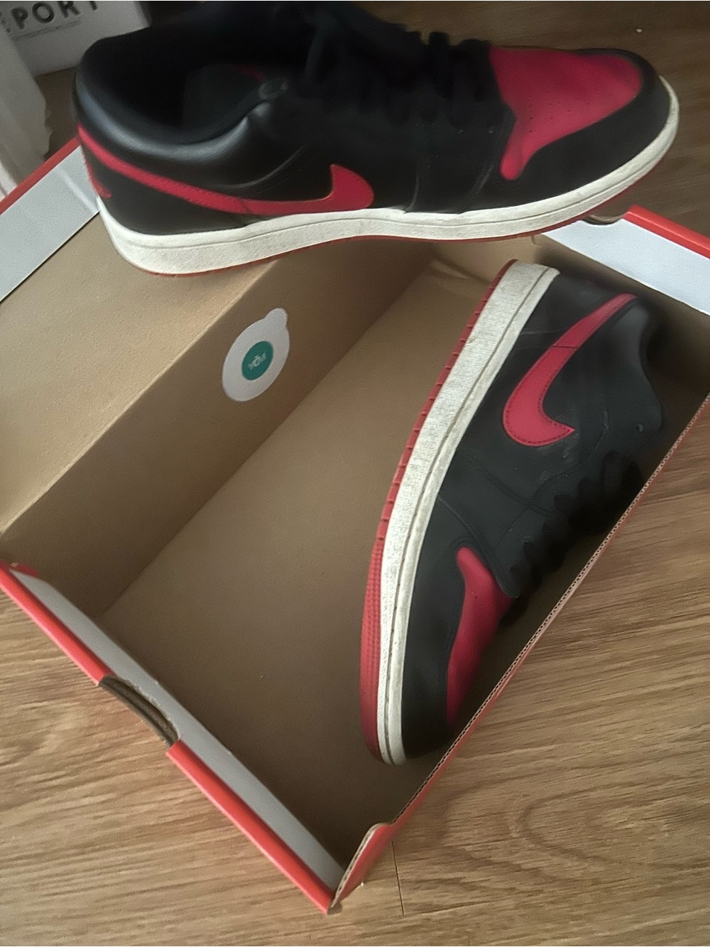 Nike Men's Black and Red Low-Top Sneakers with Red Swoosh